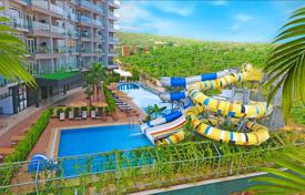 Резиденция с бассейнами, аквапарком и спа-центром в 80 метрах от моря, Мерсин, Турция за От $103 000