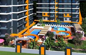 Новый жилой комплекс в центре Махмутлара, 100 метров до пляжа, Алания, Турция за От $205 000