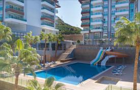 Меблированная двухкомнатная квартира в резиденции с бассейнами и теннисным кортом, в 400 метрах от моря, Каргыджак, Турция за $155 000