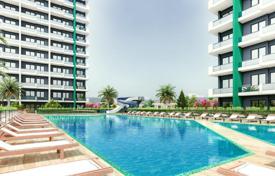 Двухкомнатные апартаменты в комплексе с бассейном и спортивными площадками, 1 км до моря и пляжей, Мерсин, Турция за От $67 000