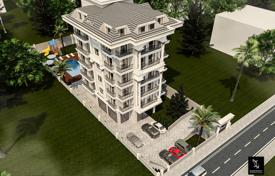Квартиры в новой резиденции с бассейном, садом и выходом к морю, Аланья, Турция за $214 000