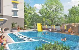 Новые квартиры с балконами в охраняемой резиденции с бассейнами, садом и аквапарком, в 120 метрах от пляжа, Махмутлар, Турция за $292 000